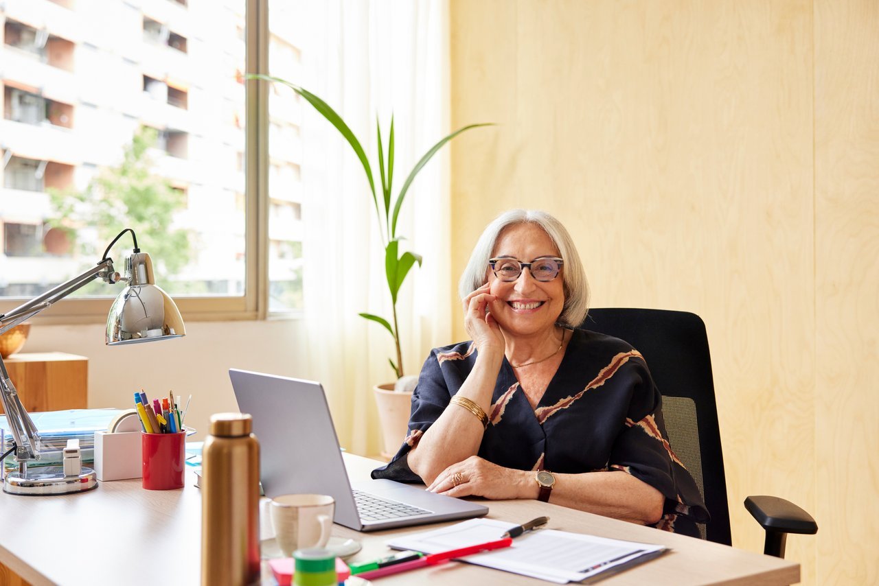 Woman smiling at desk